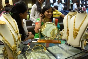 Indian women shopping for traditional gold jewellery